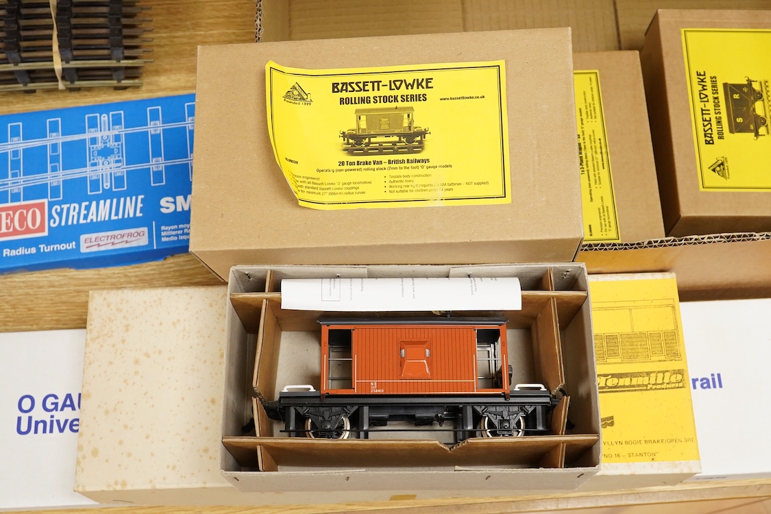 Four boxed Bassett-Lowke by Corgi 0 gauge railway freight wagons; a BR 20-ton brake van, together with two Southern Railways open wagons and a ventilated box van, together with a boxed Tenmille Products kit for a Talylly